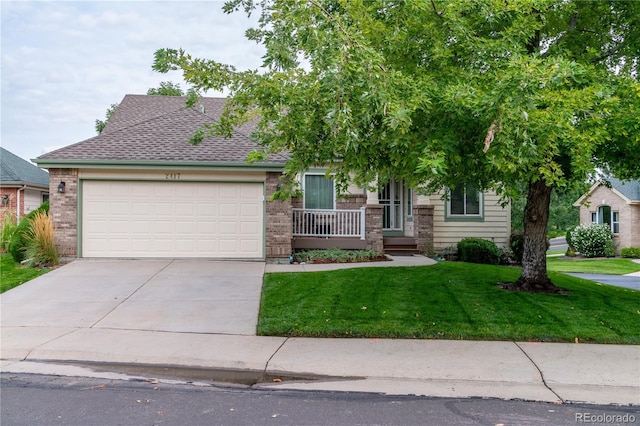 view of front facade featuring a front yard and a garage