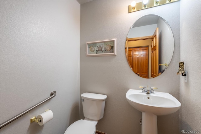 bathroom with sink and toilet