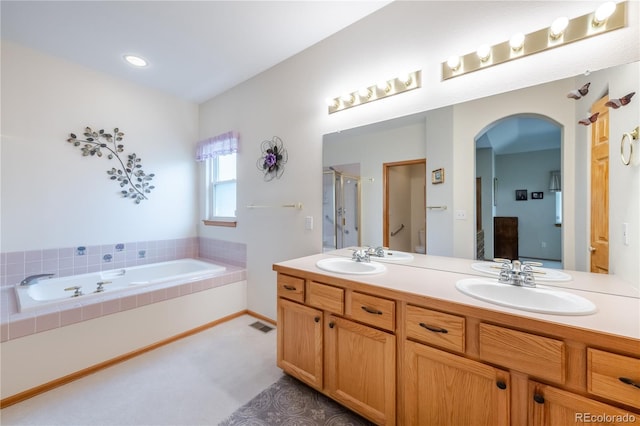 bathroom with separate shower and tub and vanity