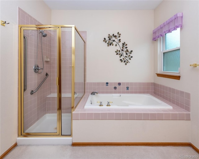 bathroom featuring separate shower and tub