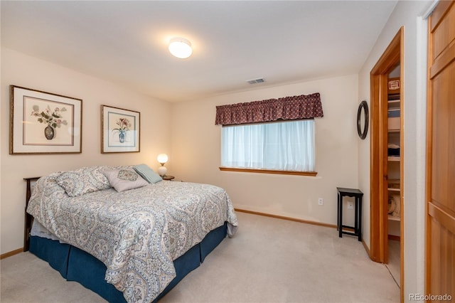 carpeted bedroom with a closet