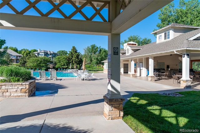 view of patio with a gazebo and a community pool