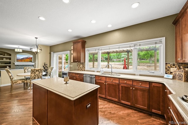15756 E Aberdeen Ave, Centennial, CO 80016 - kitchen with decorative backsplash, dark wood finished floors, light countertops, and recessed lighting