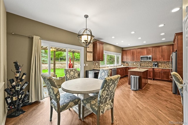15756 E Aberdeen Ave, Centennial, CO 80016 - dining room with wood finished floors and recessed lighting