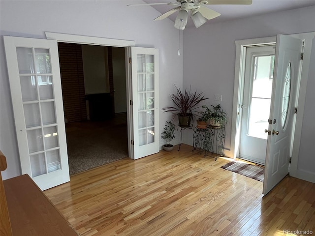 entrance foyer featuring a ceiling fan, french doors, light wood finished floors, and a wealth of natural light