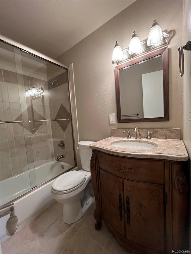6085 Simms St, Arvada, CO 80004 - bathroom featuring vanity, combined bath / shower with glass door, and tile patterned floors