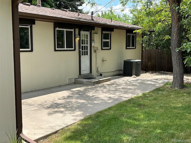 6085 Simms St, Arvada, CO 80004 - rear view of house featuring a patio and roof with shingles