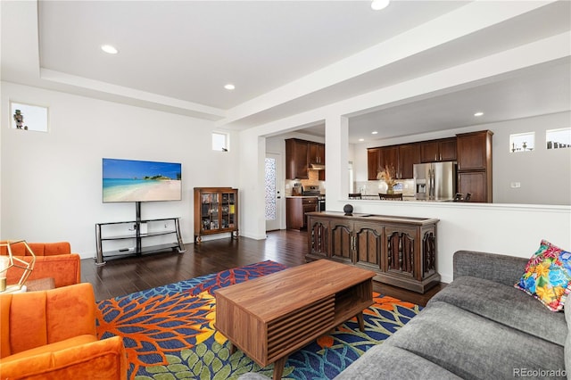 living area with recessed lighting and dark wood finished floors