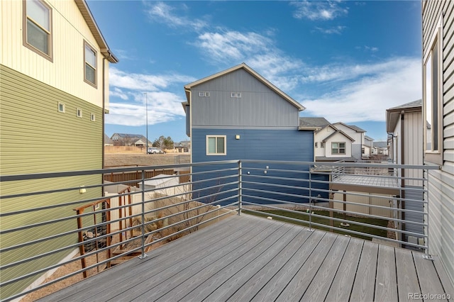 wooden deck featuring a residential view