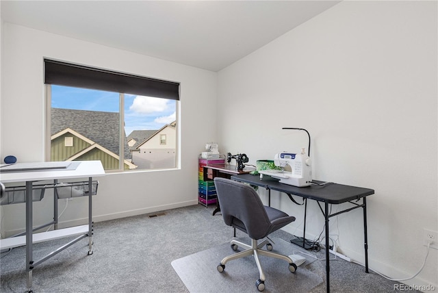 carpeted office featuring baseboards and visible vents