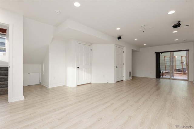 unfurnished living room featuring light wood-style floors, recessed lighting, and visible vents