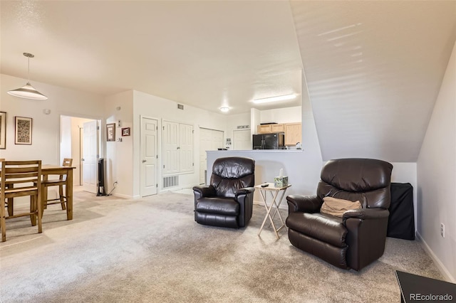 living area with light carpet