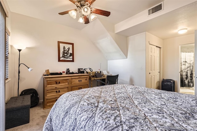 carpeted bedroom featuring a closet and ceiling fan