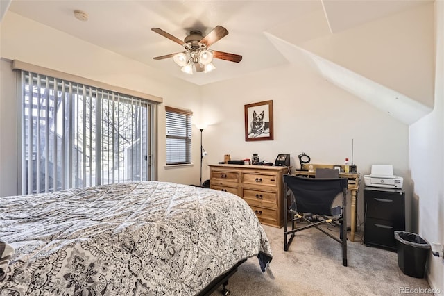 bedroom featuring lofted ceiling, light carpet, and ceiling fan