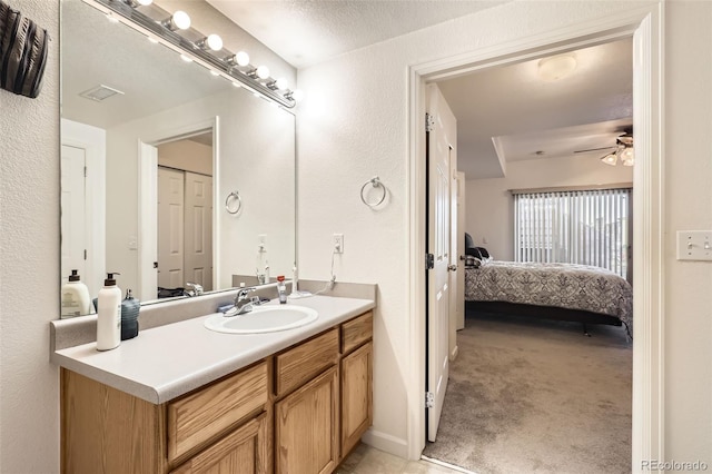 bathroom with vanity and ceiling fan