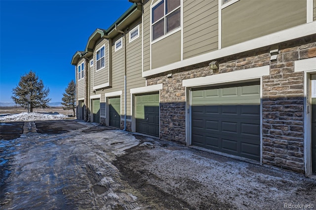 view of property exterior with a garage