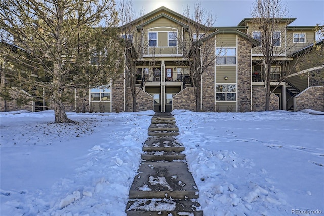 view of snow covered house