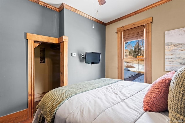 bedroom with crown molding, ceiling fan, and hardwood / wood-style flooring