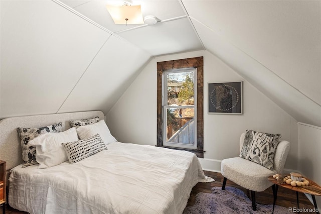 bedroom featuring vaulted ceiling and hardwood / wood-style floors