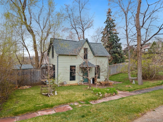 view of outbuilding featuring fence