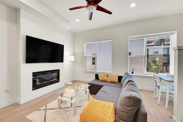 3044 Wilson Ct Unit 2, Denver, CO 80205 - living area with light wood finished floors, recessed lighting, ceiling fan, baseboards, and a glass covered fireplace