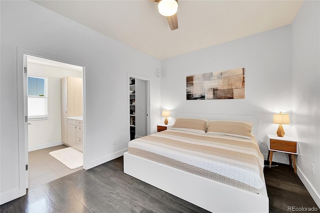 3044 Wilson Ct Unit 2, Denver, CO 80205 - bedroom with dark wood-style floors, a spacious closet, baseboards, connected bathroom, and ceiling fan