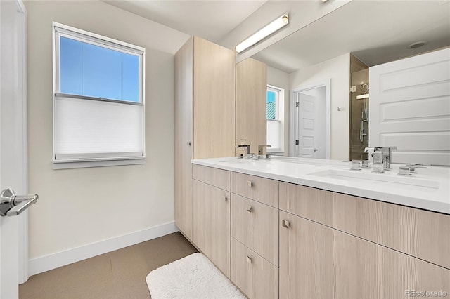 3044 Wilson Ct Unit 2, Denver, CO 80205 - bathroom featuring double vanity, baseboards, and a shower stall