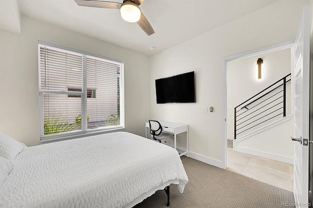 3044 Wilson Ct Unit 2, Denver, CO 80205 - bedroom with baseboards, a ceiling fan, light colored carpet, and light tile patterned flooring
