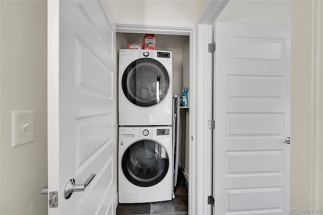 3044 Wilson Ct Unit 2, Denver, CO 80205 - laundry area featuring stacked washer / dryer and tile patterned floors