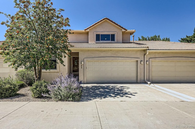 mediterranean / spanish-style home featuring a garage