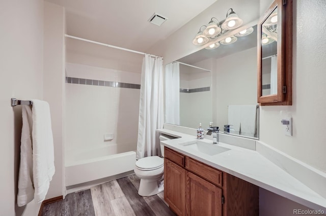 full bathroom featuring shower / bath combination with curtain, vanity, toilet, and wood-type flooring