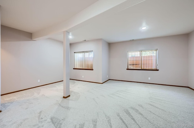 basement featuring light colored carpet