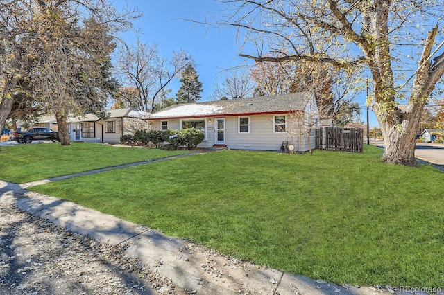 single story home featuring a front lawn