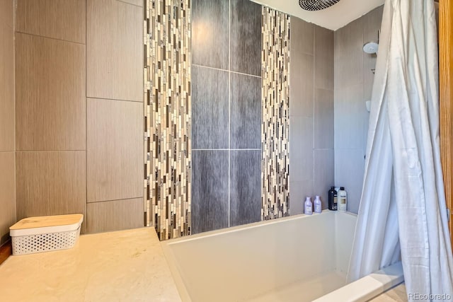 bathroom featuring tile walls