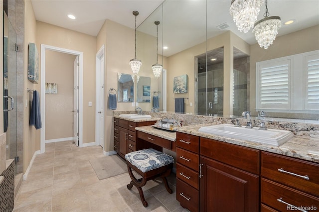full bath with vanity, a notable chandelier, a shower stall, and visible vents