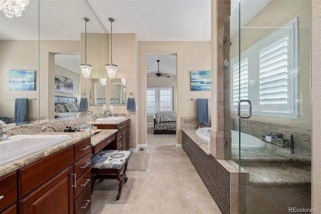 full bath featuring vanity, a stall shower, a bath, and ensuite bath