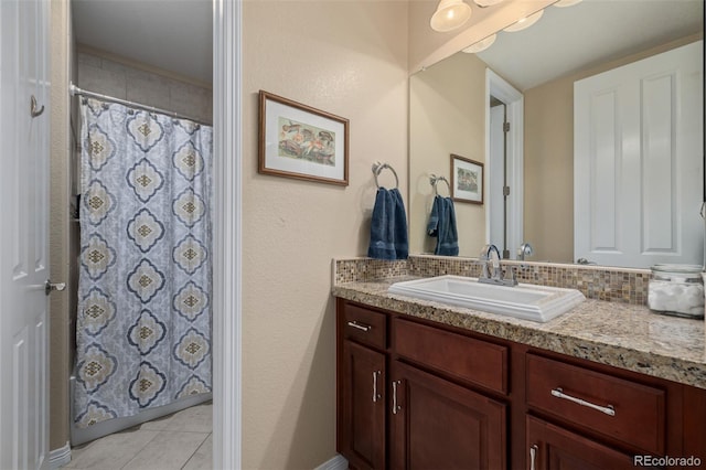 bathroom featuring vanity, a shower with shower curtain, and tile patterned flooring