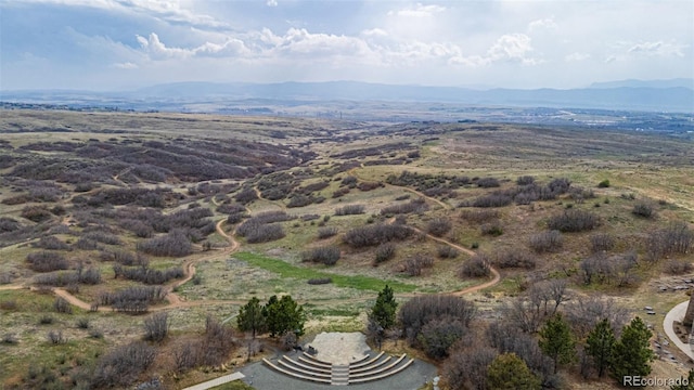 birds eye view of property featuring a mountain view