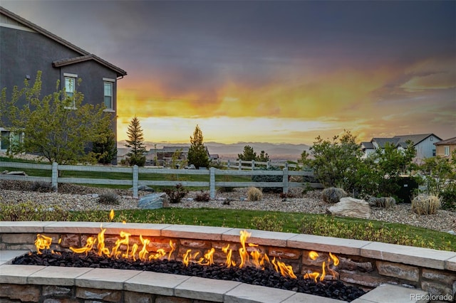 view of yard featuring fence and a fire pit