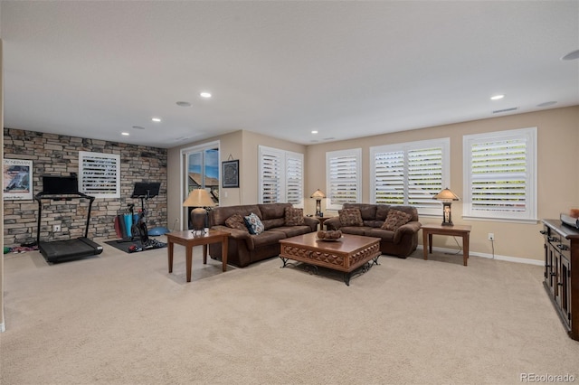 living room featuring recessed lighting, baseboards, light colored carpet, and visible vents