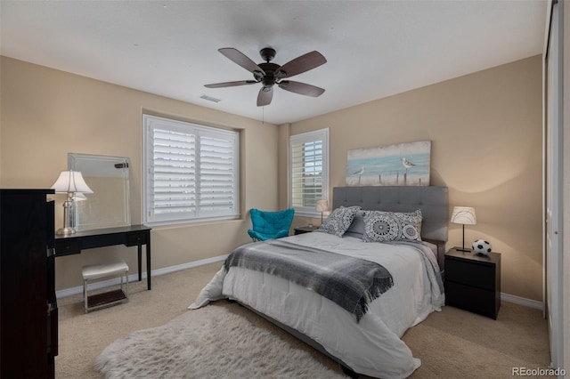 bedroom with baseboards, carpet, and a ceiling fan