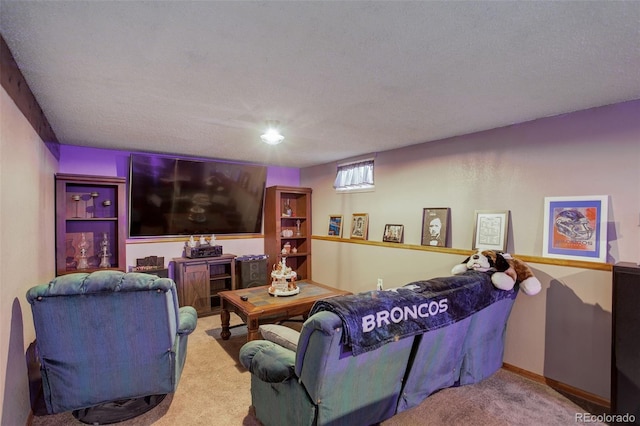 home theater room featuring carpet floors and a textured ceiling