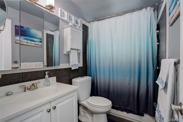 full bathroom featuring toilet, backsplash, tile walls, shower / bathtub combination with curtain, and vanity