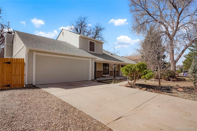 view of front of house featuring fence, an attached garage, stucco siding, a shingled roof, and concrete driveway