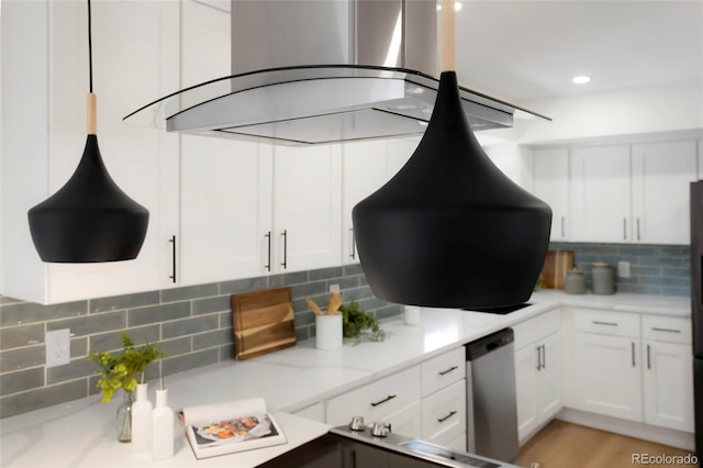 kitchen with backsplash, white cabinetry, wall chimney range hood, light stone countertops, and dishwasher