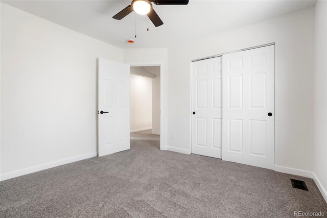 unfurnished bedroom with a closet, baseboards, visible vents, and carpet floors