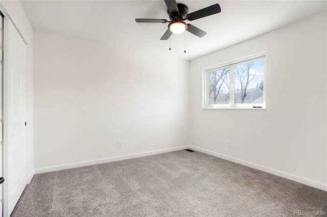 unfurnished bedroom with a closet, baseboards, and carpet