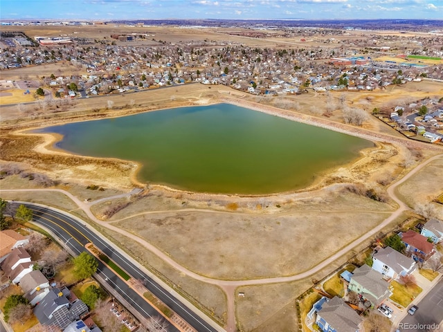 birds eye view of property featuring a residential view and a water view