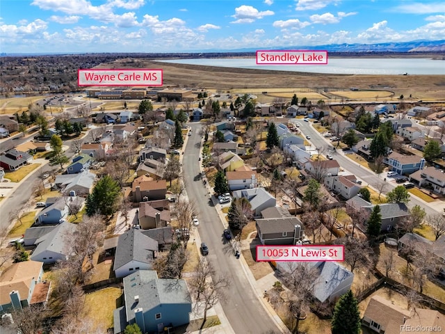 aerial view with a residential view and a water view