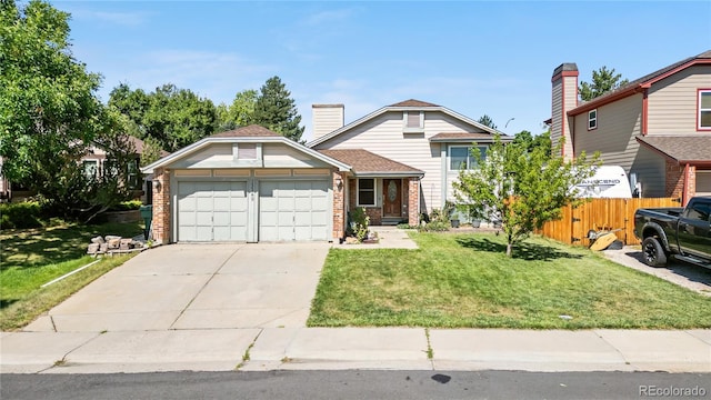 13349 Albion Cir, Thornton, CO 80241 - tri-level home featuring a garage, brick siding, and driveway